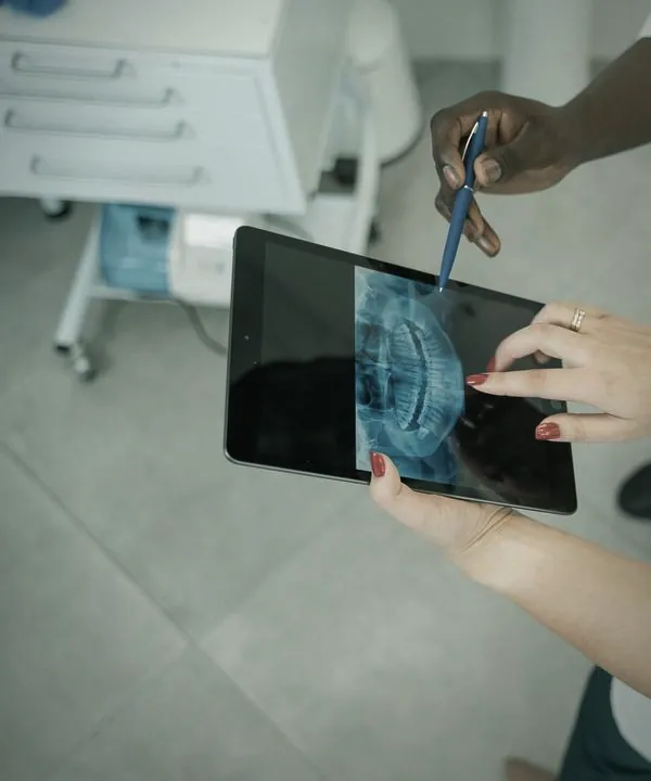 Reviewing a dental X-ray on a tablet