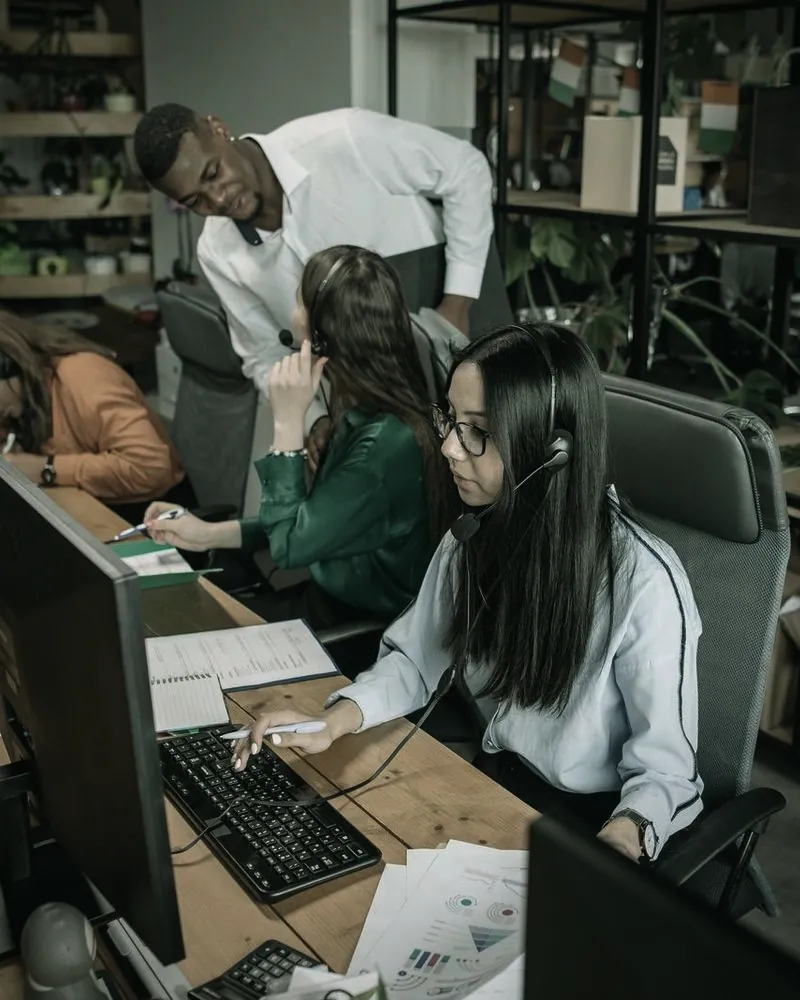 A revenue cycle team working at their computers